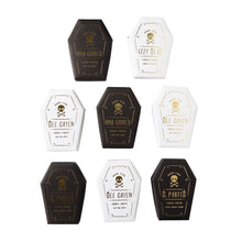 Set of Halloween-themed coffin-shaped containers with labels on a white background