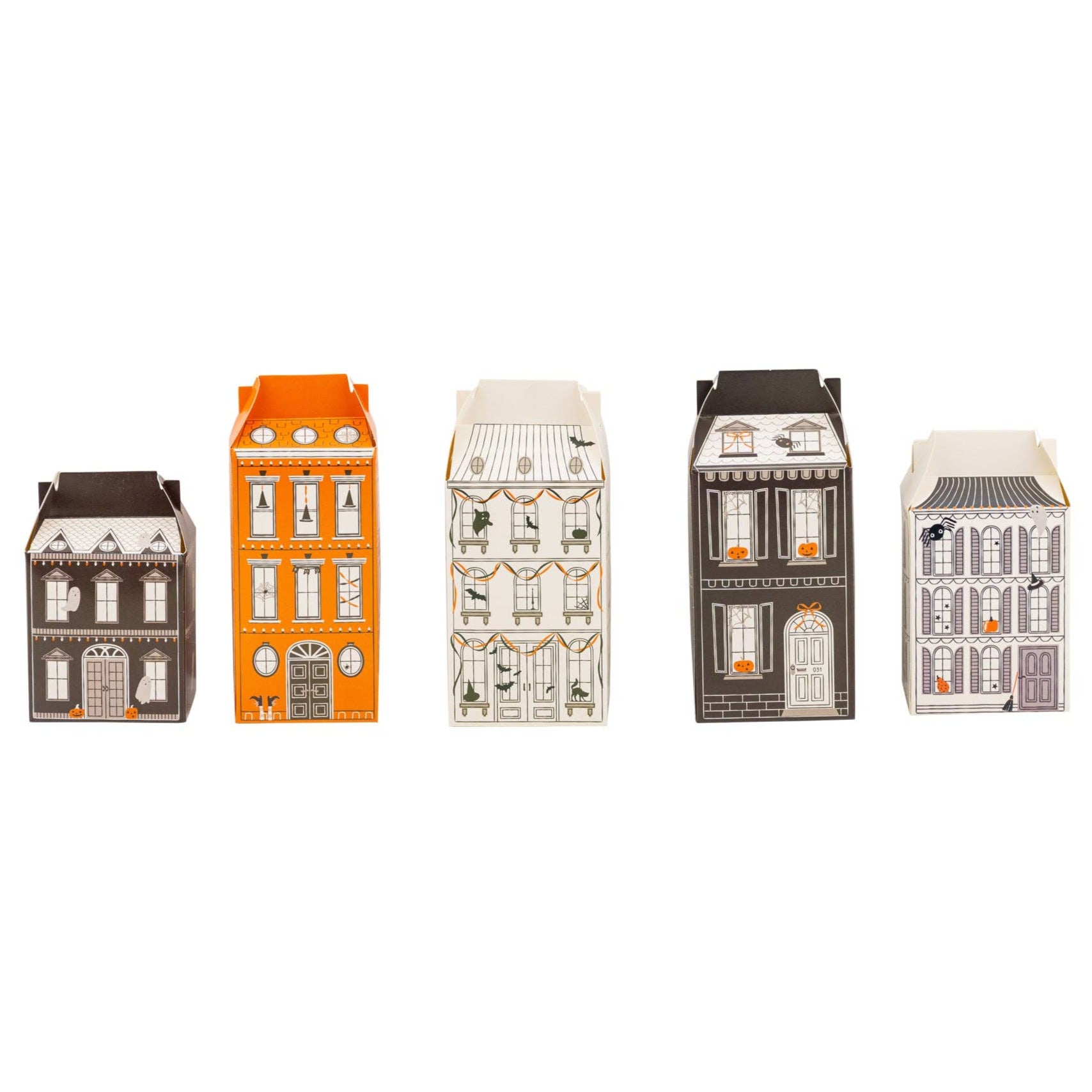 Set of miniature house-shaped boxes on a white background