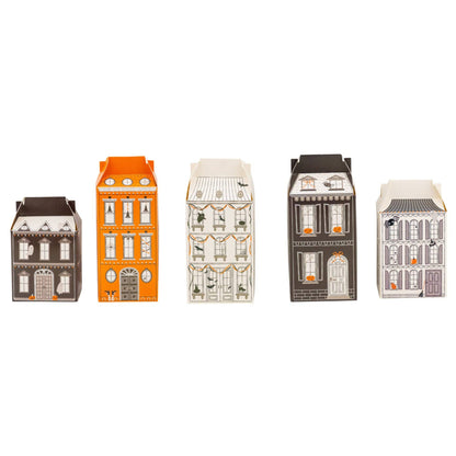 Set of miniature house-shaped boxes on a white background
