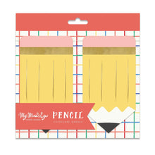 Packaged yellow pencil-shaped chipboard banners with a colorful grid background